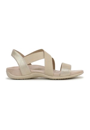 Beige sandalen met kruisbanden, synthetisch bovenwerk, elastische banden en een gestructureerd voetbed. Lichtgewicht zool met een licht gebogen vorm.