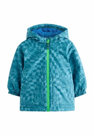 Veste bleue pour enfant avec capuche, fermeture éclair vert néon et motif intégral de dinosaures et de patins à roulettes sur fond à carreaux ondulés.
