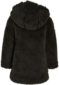 Svart fleecejakke med hette, med en myk, teksturert overflate og lange ermer. Designet er løstsittende med en rund nederkant.