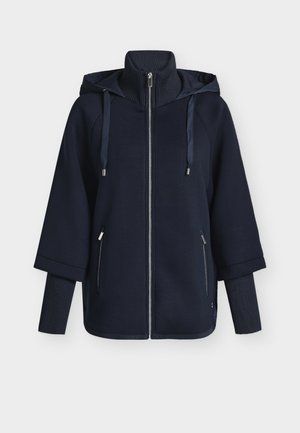 Marineblauer Hoodie mit durchgehendem Reißverschluss, hohem Kragen, Kapuze mit Kordelzug und gerippten Akzenten. Verfügt über zwei Seitentaschen und einen lockeren Sitz.