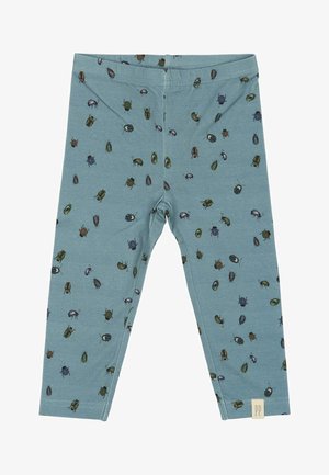 Blå leggings lavet af blødt stof, med et gentaget mønster af forskellige farverige biller. Elastisk talje, tætsiddende design, ingen lukninger.