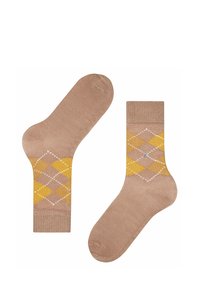 Beige Socken mit einem Diamantmuster in Gelb, Weiß und Creme. Weiches Material mit gerippten Bündchen und verstärkten Zehen- und Fersenbereichen.