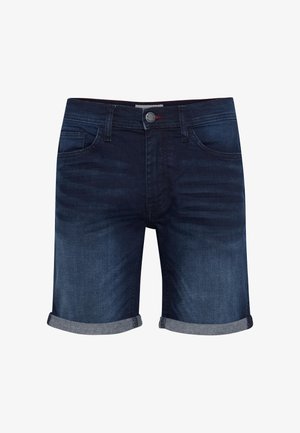 Tumedat sinist fännevad teksapüksid lühikeses variandis. Omavad üleskeeratud ääri ja esimesi taskuid ning on vöökohal kinnitatud hõbedase nupuga.