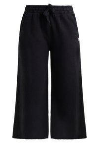 Sorte bomulds brede sweatpants med elastisk talje, snor og sidelommer, der har et lille logo på venstre hofte.