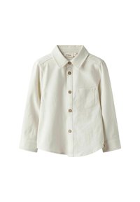 Katoenen, crèmekleurige blouse met lange mouwen, voorzien van een kraag, één borstzak en bruine knopen.