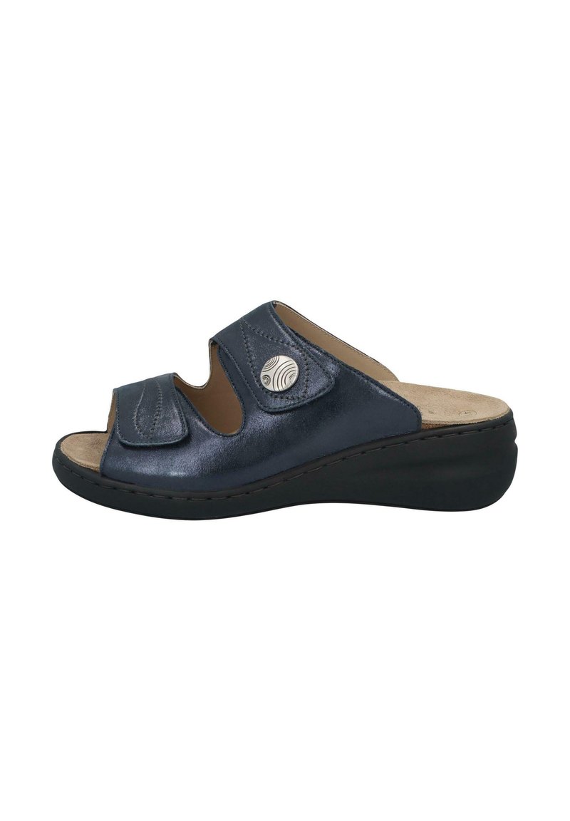 Dark blue slide sandal with open toe, adjustable straps, and a cushioned insole. Features a silver accent and a slight wedge heel.