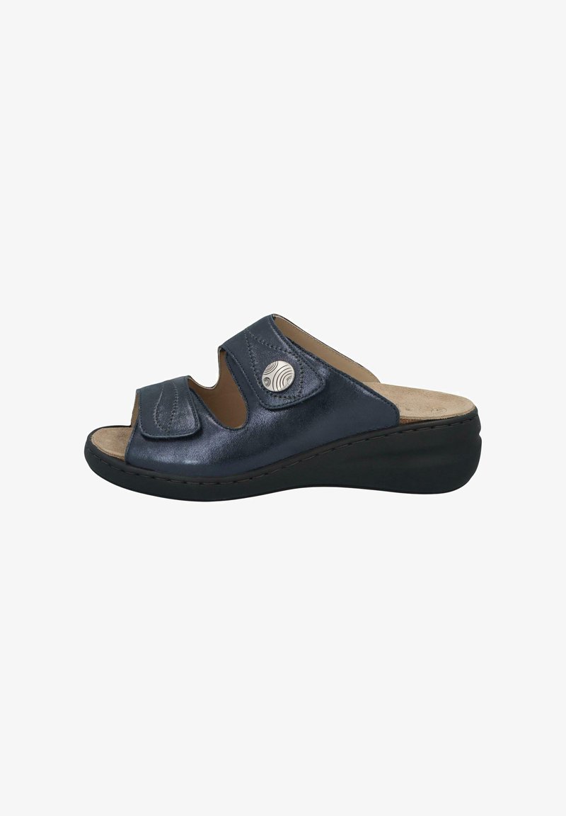 Dark blue slide sandal with open toe, adjustable straps, and a cushioned insole. Features a silver accent and a slight wedge heel.