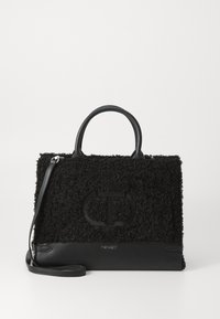 Black handbag with plush, textured fabric and smooth leather accents. Features dual handles and a detachable shoulder strap. Logo embossed on front.