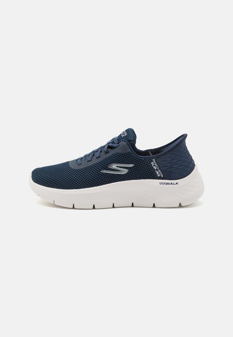 Navy blue mesh athletic shoe with a white outsole, textured heel, and logo accent; features a rounded toe and lace-up design for secure fit.