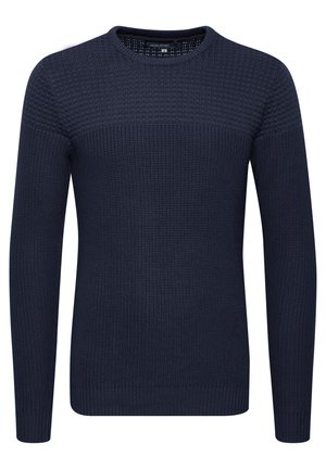 Tumedan sinine kudumine särk tekstuuriga mustriga, ümmargune kaelus ning soonikkoes mansetid ja äär. Särgil on sile ülemine osa.