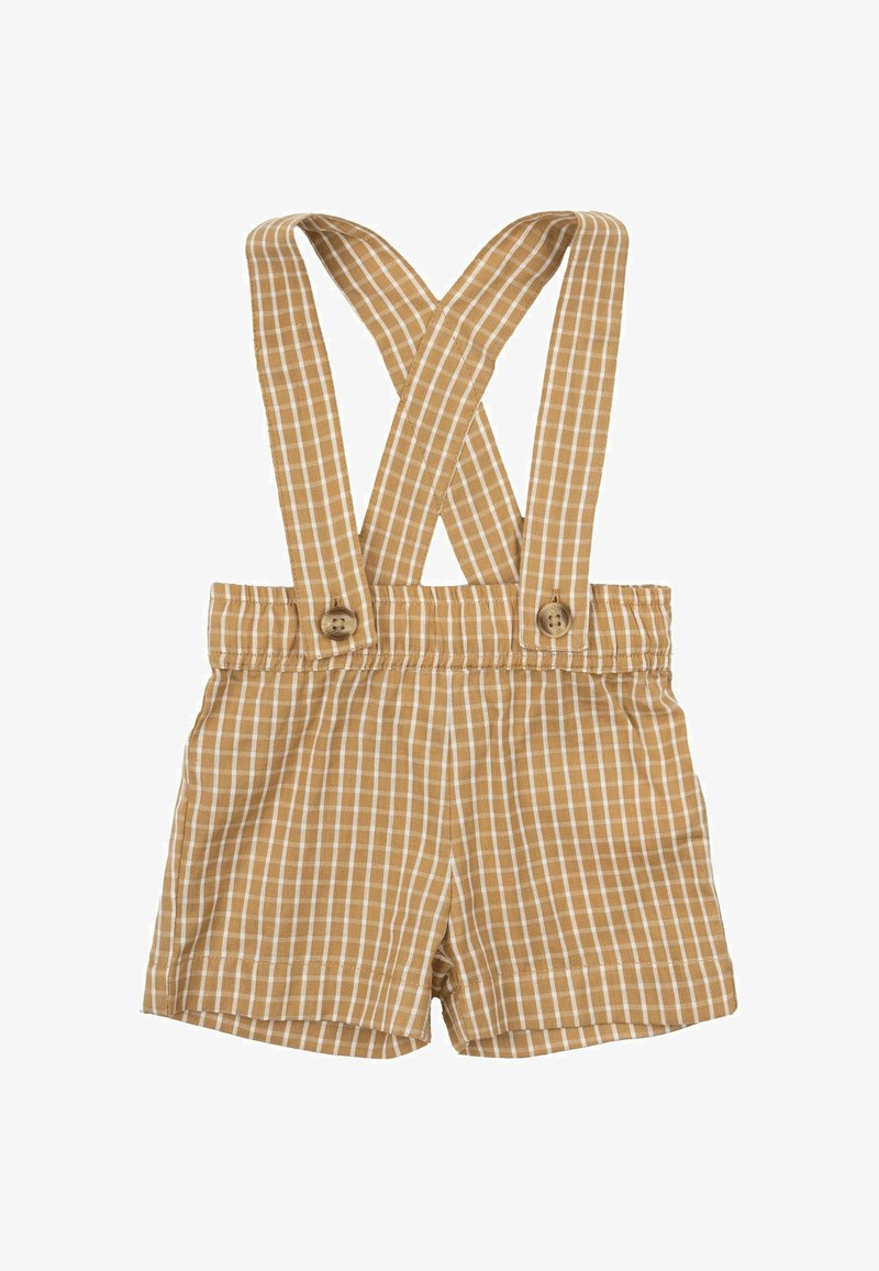 Shorts à carreaux beiges et blancs avec des bretelles croisées, présentant des fermetures à bouton en bois, une taille élastique et une texture de tissu douce.