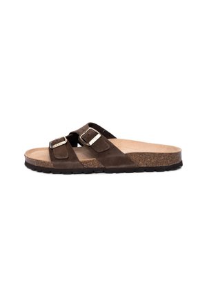 Brown suede slide sandals with two adjustable straps and silver buckles. Cork footbed, textured rubber sole, and flat design.