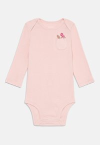 Light pink long-sleeve onesie with a round neckline, featuring a small pocket with floral embroidery and snap closures at the bottom.