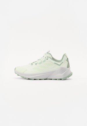 Light green running shoe with a breathable mesh upper, textured accents, cushioned sole, and a slightly raised heel for stability.