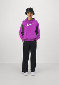Nike Sportswear PANT - Tracksuit bottoms - black/white