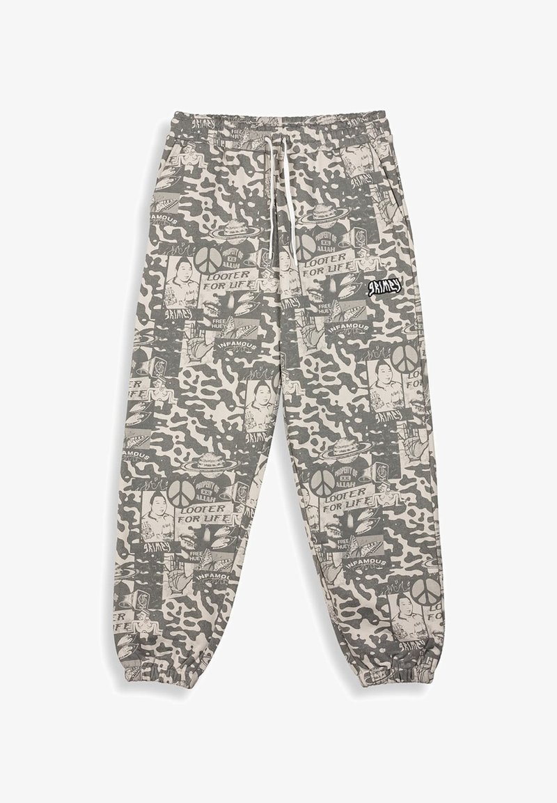 Grau camouflierte Jogginghosen mit weißen Grafikdrucken, elastischem Bund und Bündchen. Sie verfügen über verschiedene Muster und ein kleines Markenlogo.