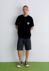Carhartt WIP AMOUR POCKET - T-shirts med print - black/white