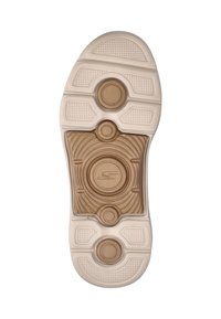Zool van een sneaker, met een getextureerde witte rubberen buitenkant, tan-kleurige cirkelvormige dempingspods en een golvend ontwerp in het midden.
