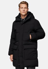 Black padded coat with a hood, featuring large front pockets, concealed fastenings, and a smooth, textured finish.