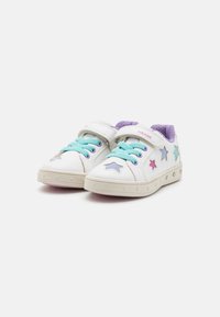 White sneakers with a rounded toe, featuring turquoise laces, a velcro strap, and colorful star accents in pink, purple, and blue.