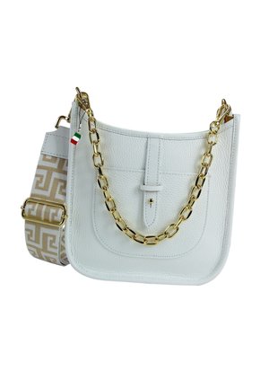 White leather handbag with a textured surface, gold chain handle, and a patterned fabric strap featuring a geometric design in beige.