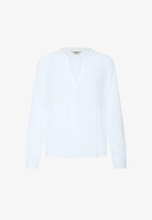 Blouse blanche à manches longues avec col en V échancré, poignets élastiques et coupe ample, présentée sur un fond blanc uni.