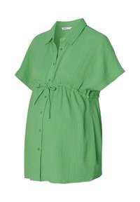 Groene button-up shirt met korte mouwen en een strik om de taille. Gemaakt van een textuurstof met een losse pasvorm, voorzien van een kraag en kleine knopen.