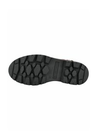 Semelle en caoutchouc noir avec un motif de semelle robuste featuring des griffes hexagonales et circulaires, étiquetée avec la taille 37 et le nom de la marque "Trekking."
