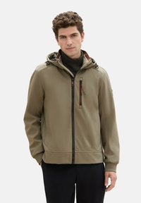 Olive green softshell jacket with a hood, zippered front, and chest pocket. Features elastic cuffs and a sleek, tailored design.