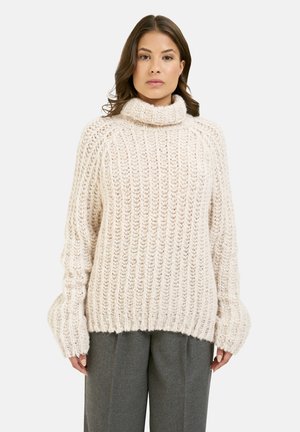 Flauschiger cremefarbener Strickpullover mit hohem Kragen, oversized Schnitt und gerippter Textur. Verfügt über weit geschnittene Ärmel und eine lässige Silhouette.