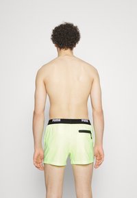 Puma SWIM MEN LOGO - Plaukimo šortai - fast yellow