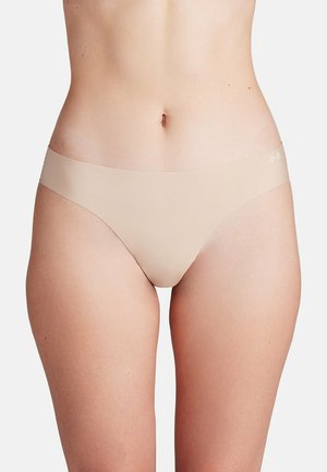 Nude naadloze slipjes met een gladde textuur en minimale bedekking. Kenmerkt zich door een brede waistband en een subtiele merklogo aan de zijkant.