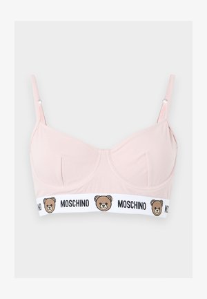 Hellrosa BH mit verstellbaren Trägern, Bügel-Cups und weißem Elastikband mit Teddybär-Gesichtern und schwarzem "MOSCHINO"-Schriftzug.