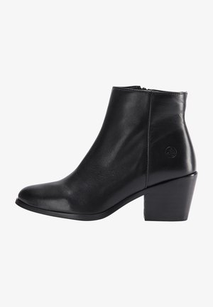 Bottine en cuir noir avec fermeture éclair latérale, talon bloc, bout arrondi et logo embossé discret près du talon.