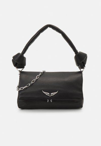 Black leather handbag with a structured shape, chain and knotted handle accents, and a silver wing-shaped logo on the front.