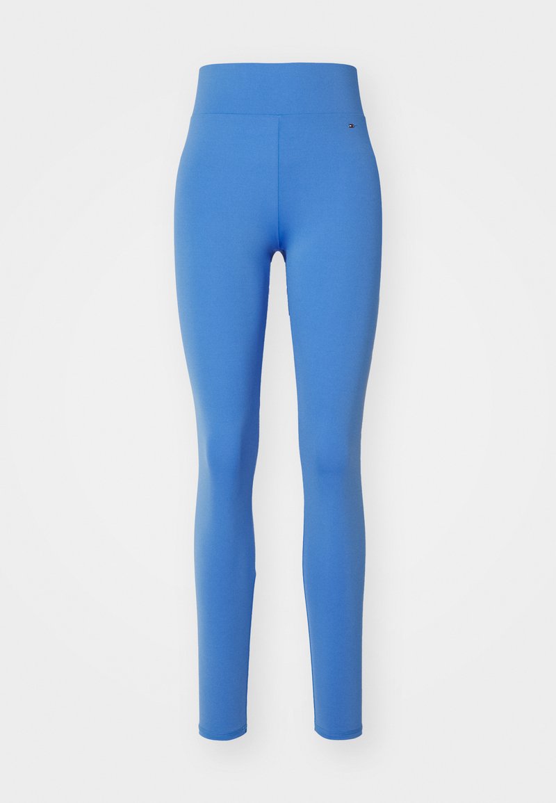 Colanți albaștri cu un brâu înalt, realizați dintr-un material elastic. Textură netedă, design ajustat, potrivit pentru îmbrăcăminte sport.