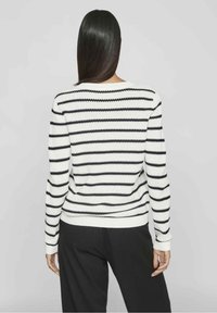 Black and white striped sweater with a round neckline, ribbed cuffs, and hem; features a textured knit pattern; loose fit.