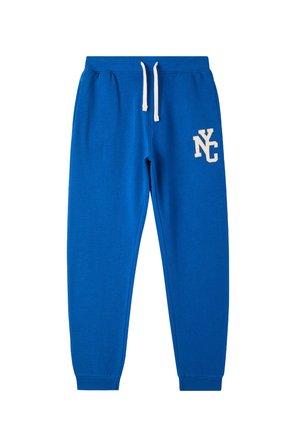 Pantaloni della tuta in cotone blu con vita regolabile, polsini a costine e un logo bianco "NYC" sulla coscia sinistra. Tessuto liscio, design casual.