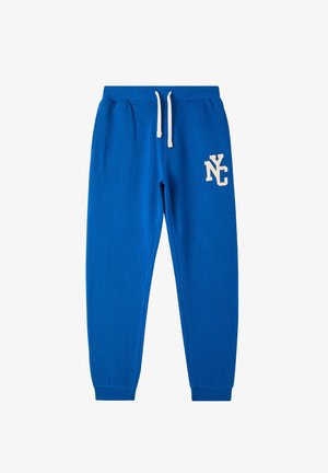 Niebieskie bawełniane dresy z troczkiem w pasie, prążkowanymi mankietami i białym logo "NYC" na lewej udzie. Gładka tekstura, swobodny design.