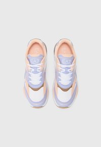 Sneakers featuring a mesh upper in white, light pink, and lavender with brown accents, round toe, and contrasting stitching. Logo on tongue.