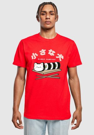 Red cotton t-shirt featuring a graphic of a white cat and sushi, with wood chopsticks. The text above reads "小さな犬" with "RAMEN COMPANY" below.