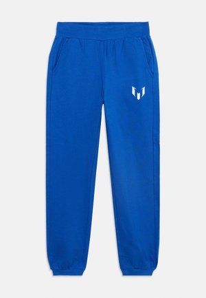Blå joggingbukser med elastisk linning og manchetter, sidelommer og en hvid stiliseret logo på højre lår.