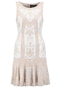 Robe sans manches beige avec des broderies blanches intriquées, des motifs floraux et une jupe évasée. Dotée d'une fermeture éclair au dos et d'un tissu texturé.