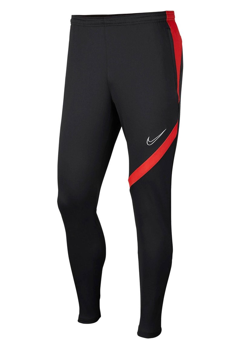 Leggings deportivos negros con un diseño ajustado, que presentan una franja lateral roja y un logo de Nike blanco en la parte frontal. Están fabricados con un tejido elástico.
