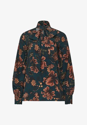 Donkerblauwe blouse met een bloemenpatroon in roest- en goudtinten. Heeft een hoge hals en strikdetail, lange mouwen met gevoegde manchet.