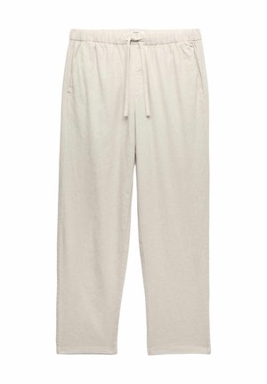 Beżowe, lekkie spodnie codzienne z elastycznym pasem, regulowanym troczkiem i bocznymi kieszeniami, pokazane na białym tle.