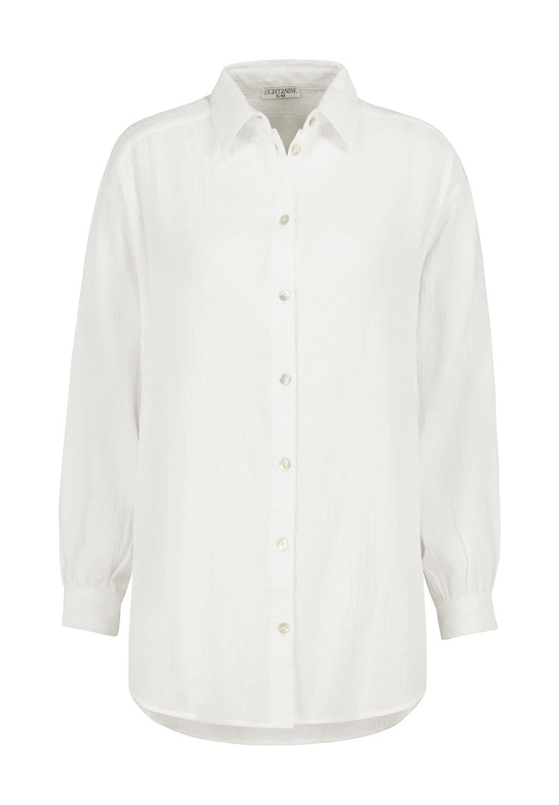 Weiße Hemdbluse mit langen Ärmeln, gefertigt aus strukturiertem Stoff. Verfügt über einen klassischen Kragen und perlmuttartige Knöpfe entlang der Vorderseite.