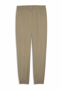 Μπεζ, ελαφριά παντελόνια με ελαστική μέση, στενές κατώτερες μανσέτες και λεία υφή. Χωρίς ορατές τσέπες ή σχέδια.