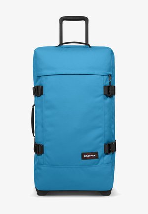 Blaues rollendes Reisetasche aus strapazierfähigem Material, rechteckige Form, schwarze Schnallen, Traggriff und Markenlogo auf der Vorderseite.