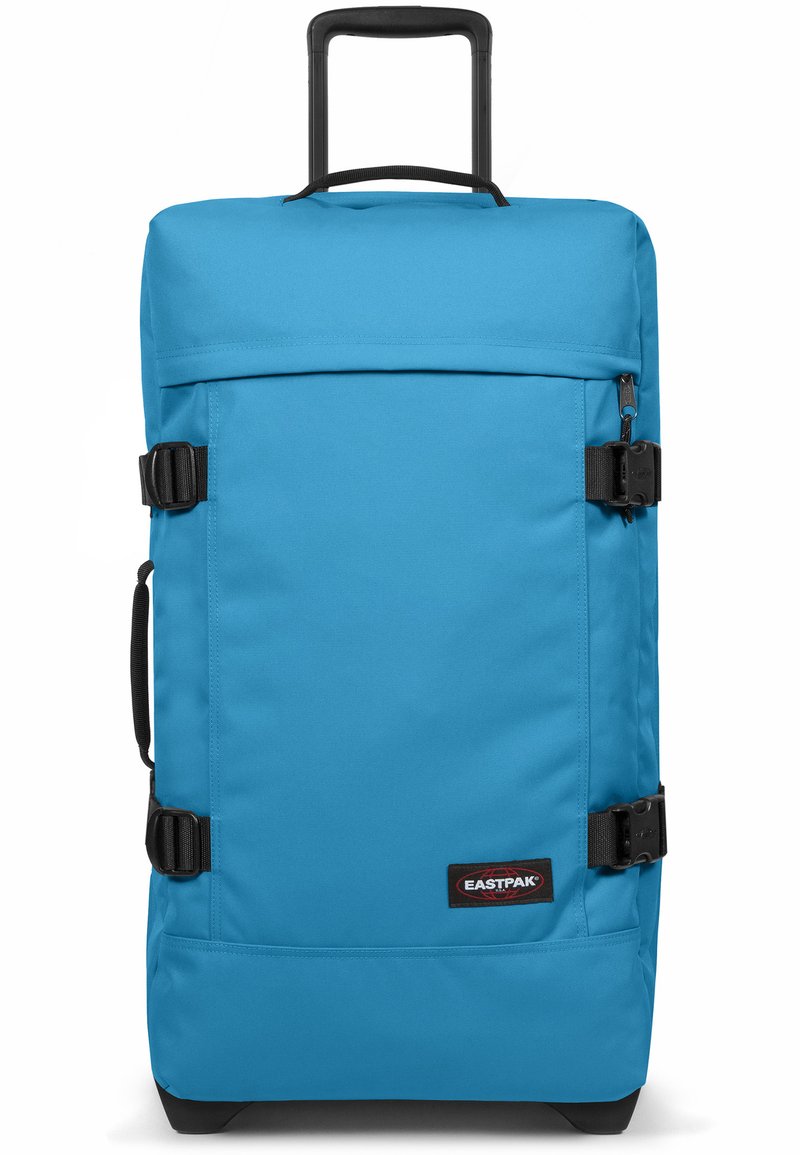 Borsone blu con tessuto resistente, forma rettangolare, fibbie nere, manico per il trasporto e logo del marchio sul davanti.